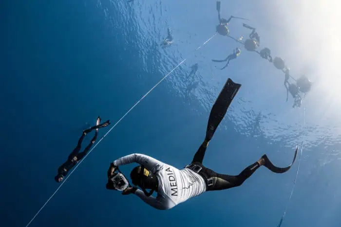 Benjamin photographing a freediving athlete on their descent. Photo by Pablo Zhang.
