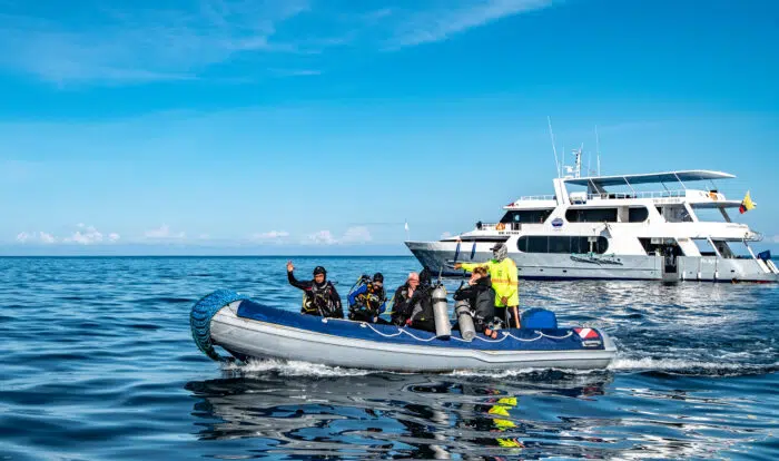 Galapagos Aggressor II and Guests at Isla Fernandina. Photo By Mark B. Hatter