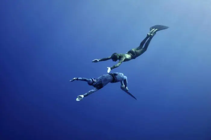 Two freedivers fun diving together.