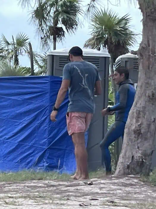 William Trubridge accompanying a male athlete for an unofficial doping control with a multi-panel urine drug test.